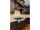Gourmet kitchen featuring a stainless steel range and dark wood cabinetry at 14022 E Fair Pl, Centennial, CO 80111