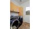Well-equipped laundry room boasts sleek, modern washer and dryer units at 14022 E Fair Pl, Centennial, CO 80111