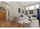 Beautiful living room with hardwood floors, comfortable seating, and plenty of natural light at 14022 E Fair Pl, Centennial, CO 80111