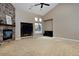 Spacious living room boasts vaulted ceilings and a stone fireplace at 14022 E Fair Pl, Centennial, CO 80111