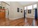 Spacious living room with soaring ceilings, hardwood floors, and large windows at 14022 E Fair Pl, Centennial, CO 80111