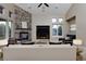Well-designed living room with a stone fireplace and multiple windows at 14022 E Fair Pl, Centennial, CO 80111