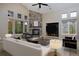 Comfortable living room featuring a stone fireplace and vaulted ceiling at 14022 E Fair Pl, Centennial, CO 80111