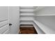 Spacious pantry with shelving to maximize storage at 14022 E Fair Pl, Centennial, CO 80111