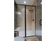 Modern tiled shower with glass enclosure and built-in bench seating at 14022 E Fair Pl, Centennial, CO 80111