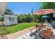 Beautiful backyard featuring a well-maintained lawn and a picnic table at 1922 Graves Ct, Northglenn, CO 80233
