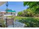 Inviting backyard with a patio seating area and mature trees at 1922 Graves Ct, Northglenn, CO 80233