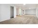Spacious basement with carpet flooring and white walls, perfect for storage or recreation at 1922 Graves Ct, Northglenn, CO 80233