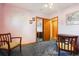 Bright bedroom featuring chair rail, neutral walls and ample space at 1922 Graves Ct, Northglenn, CO 80233