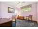 Cozy bedroom with a ceiling fan, vintage furniture and a charming ambiance at 1922 Graves Ct, Northglenn, CO 80233