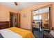 Comfortable bedroom with mirrored closet, ceiling fan and ample space at 1922 Graves Ct, Northglenn, CO 80233