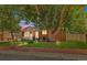 Charming brick home featuring a spacious front yard with mature trees and classic curb appeal at 1922 Graves Ct, Northglenn, CO 80233