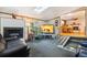 Cozy living room with a fireplace, large television, and ample seating at 1922 Graves Ct, Northglenn, CO 80233