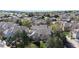 Picturesque aerial shot of a quiet residential neighborhood with mature trees and well-maintained townhomes under a blue sky at 1381 W 112Th Ave # B, Westminster, CO 80234