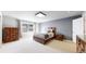 Spacious bedroom featuring a window, carpeted floors, neutral wall color, and modern lighting at 1381 W 112Th Ave # B, Westminster, CO 80234