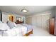 Spacious bedroom featuring a window, carpeted floors, neutral wall color, and dual closets at 1381 W 112Th Ave # B, Westminster, CO 80234
