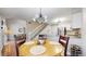 Cozy dining area with modern chandelier, seating for four, and adjacent to the kitchen and stairs at 1381 W 112Th Ave # B, Westminster, CO 80234
