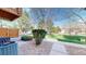 View of front yard with mature landscaping, including trimmed bushes, trees and a well manicured lawn on a sunny day at 1381 W 112Th Ave # B, Westminster, CO 80234