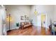 Open-concept living room with vaulted ceilings, hardwood floors, and stylish decor with a staircase view at 1381 W 112Th Ave # B, Westminster, CO 80234