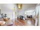 Bright living room featuring an electric fireplace, open floor plan, hardwood floors and a staircase at 1381 W 112Th Ave # B, Westminster, CO 80234