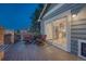 Back porch featuring outdoor seating and an open view to the kitchen through a sliding glass door at 1497 Bent Grass Cir, Castle Rock, CO 80109