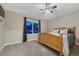 Cozy bedroom with a large window, plush carpet, and ample natural light at 1497 Bent Grass Cir, Castle Rock, CO 80109
