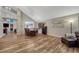 Open dining area featuring wood floors, high ceilings, and adjacent kitchen at 1497 Bent Grass Cir, Castle Rock, CO 80109