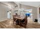 Elegant dining room featuring a grand table set for six and contemporary chandelier lighting at 1497 Bent Grass Cir, Castle Rock, CO 80109
