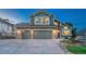 Two-story home featuring a three-car garage, well-maintained lawn, and lovely landscaping at 1497 Bent Grass Cir, Castle Rock, CO 80109