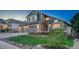 Charming two-story home with a well-manicured lawn, a three car garage, and beautiful landscaping at 1497 Bent Grass Cir, Castle Rock, CO 80109