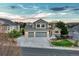 Charming two-story home with a well-manicured lawn and a three car garage at 1497 Bent Grass Cir, Castle Rock, CO 80109