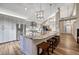 Spacious kitchen with a large center island, modern appliances, and stylish pendant lighting at 1497 Bent Grass Cir, Castle Rock, CO 80109
