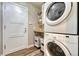 Convenient laundry room with stacked washer and dryer, plus ample storage at 1497 Bent Grass Cir, Castle Rock, CO 80109