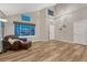 Spacious living room with wood floors, vaulted ceilings, and large windows at 1497 Bent Grass Cir, Castle Rock, CO 80109