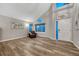 Bright living room with vaulted ceilings, wood floors, and natural light at 1497 Bent Grass Cir, Castle Rock, CO 80109