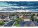 A lovely neighborhood is featured here with well maintained homes and a cloudy sky above at 1497 Bent Grass Cir, Castle Rock, CO 80109