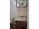 Bathroom showing a toilet and sink with a tiled floor and water stained walls at 18249 E Mexico Pl, Aurora, CO 80017