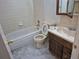 Bathroom featuring a tile bathtub, toilet, sink, and vanity with medicine cabinet at 18249 E Mexico Pl, Aurora, CO 80017