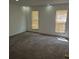 Bedroom featuring neutral carpet, white walls, and two windows with light-blocking blinds at 18249 E Mexico Pl, Aurora, CO 80017