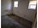 Empty bedroom featuring two windows offering natural light, with carpeted floors at 18249 E Mexico Pl, Aurora, CO 80017
