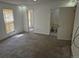 Bedroom featuring neutral carpet, white walls, two doors, and a window with blinds at 18249 E Mexico Pl, Aurora, CO 80017