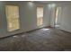 Bedroom featuring neutral carpet, white walls, and two windows with light-blocking blinds at 18249 E Mexico Pl, Aurora, CO 80017