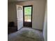 Bedroom featuring neutral carpet, white walls, and a door to an exterior deck at 18249 E Mexico Pl, Aurora, CO 80017