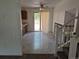 Cozy dining area features tile flooring and access to outdoor patio, next to stairs at 18249 E Mexico Pl, Aurora, CO 80017