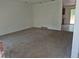 Cozy living room featuring neutral carpet and an open layout to the kitchen at 18249 E Mexico Pl, Aurora, CO 80017