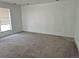 Bright living room with neutral carpet and large window bringing in natural light at 18249 E Mexico Pl, Aurora, CO 80017