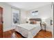 Main bedroom with hardwood floors and a view of the street from the window at 3924 Xavier St, Denver, CO 80212