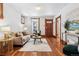 Spacious living room with hardwood floors, a neutral color palette, and ample natural light at 3924 Xavier St, Denver, CO 80212