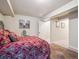 Bedroom with carpeted floors and neutral-colored walls at 4151 S Lewiston Cir, Aurora, CO 80013