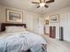 Bright bedroom with carpeted floors, ceiling fan and two closets at 4151 S Lewiston Cir, Aurora, CO 80013